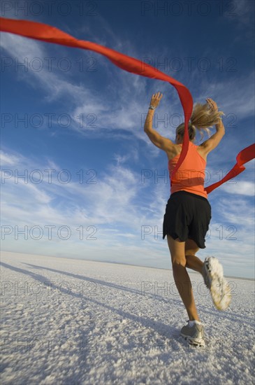 Woman running across finish line, Utah, United States. Date : 2007