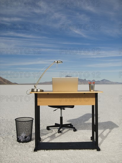 Desk with laptop on salt flats, Salt Flats, Utah, United States. Date : 2007