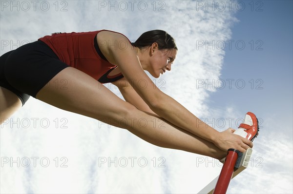 Female athlete stretching, Utah, United States. Date : 2007