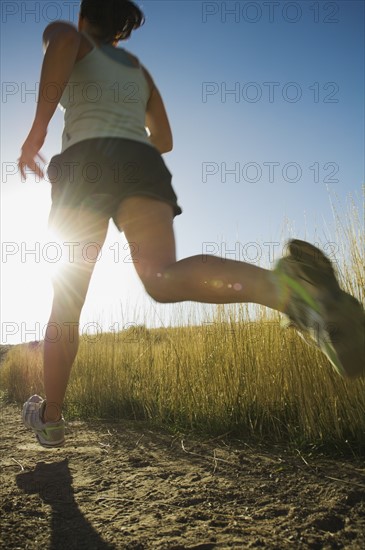 Woman running on trail, Salt Flats, Utah, United States. Date : 2007