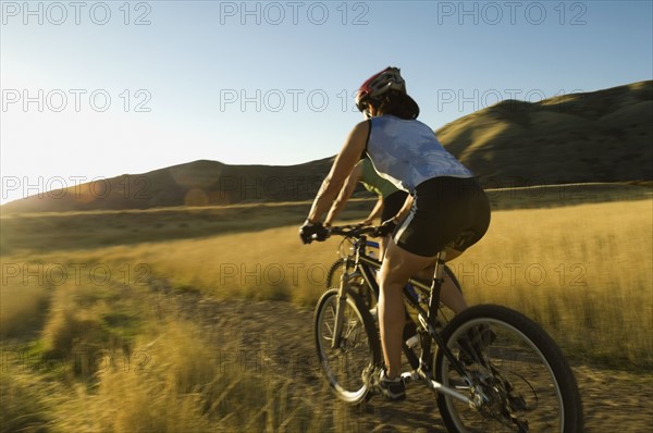 People riding mountain bikes, Salt Flats, Utah, United States. Date : 2007