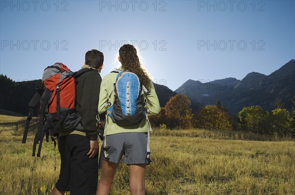 Couple wearing backpacks outdoors, Utah, United States. Date : 2007