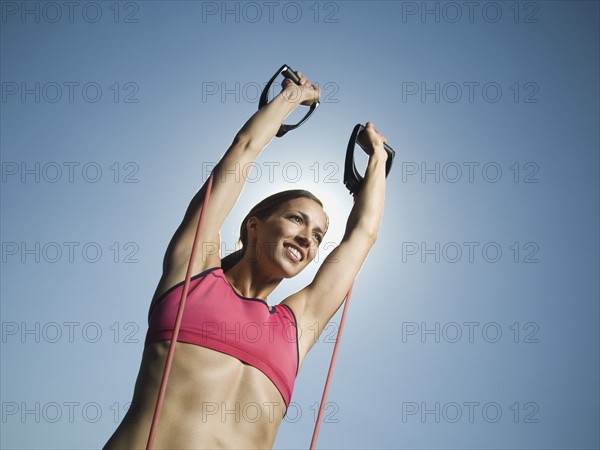 Woman in athletic gear exercising. Date : 2007