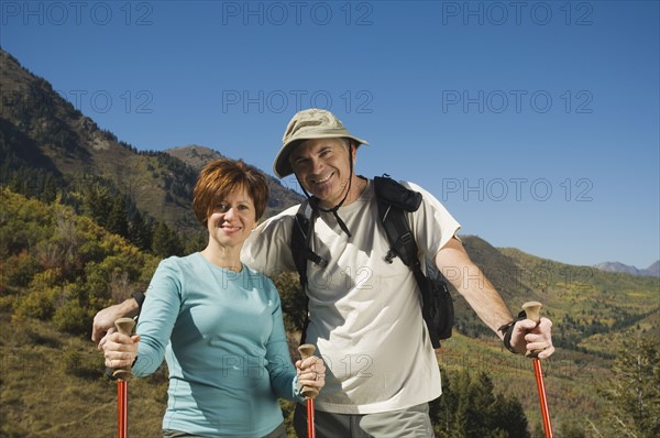 Senior couple holding hiking poles, Utah, United States. Date : 2007