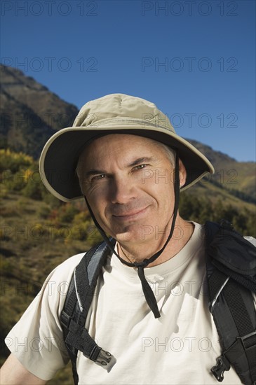 Senior man wearing backpack, Utah, United States. Date : 2007