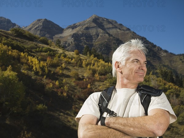 Senior man wearing backpack, Utah, United States. Date : 2007