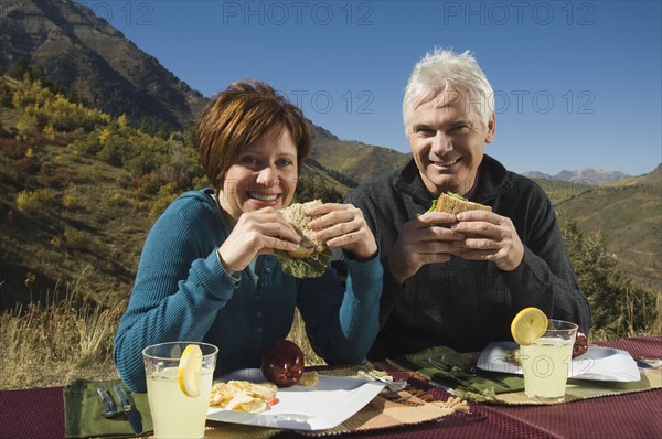 Senior couple eating outdoors, Utah, United States. Date : 2007