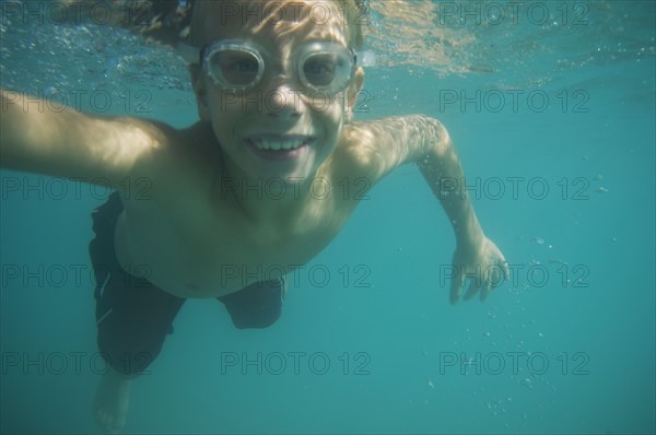 Underwater shot of boy swimming, Utah, United States. Date : 2007