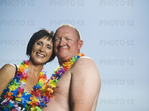 Couple wearing flower leis. Date : 2007