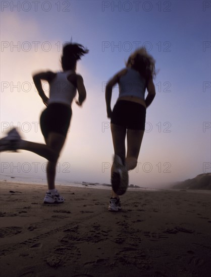 Women jogging on beach. Date : 2007