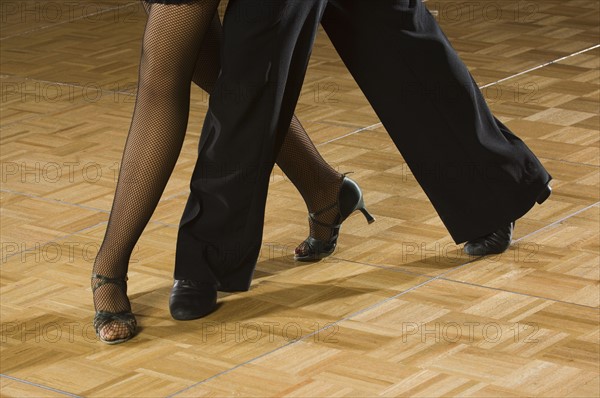 Close up of couple salsa dancing. Date : 2007