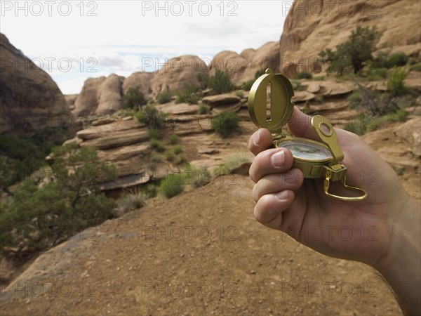 Man holding compass. Date : 2007