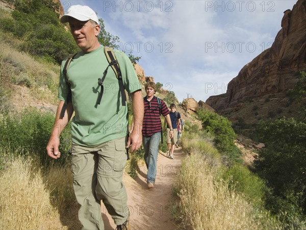 Family hiking in desert. Date : 2007