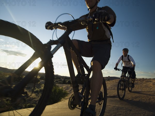 People riding mountain bikes. Date : 2007