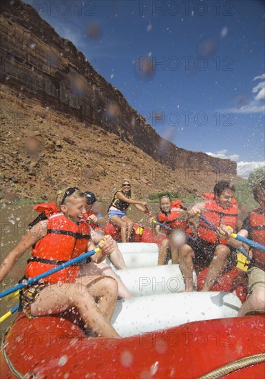 People paddling in raft. Date : 2007