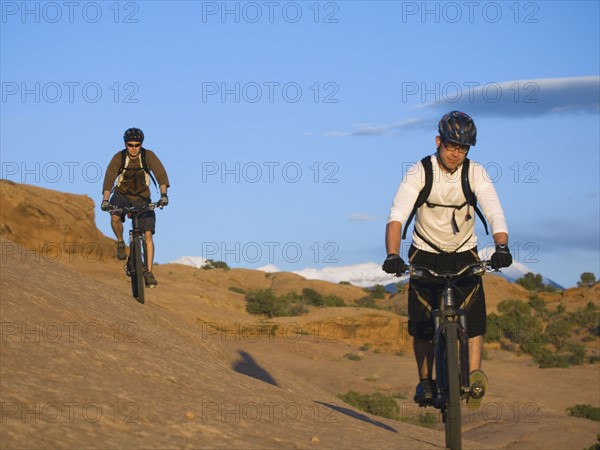 People riding mountain bikes. Date : 2007