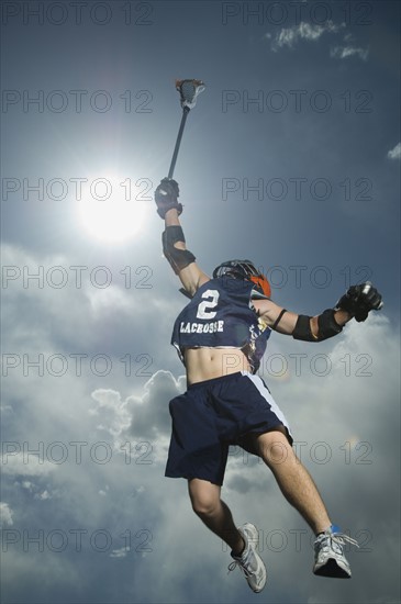 Low angle view of jai-alai player jumping. Date : 2007