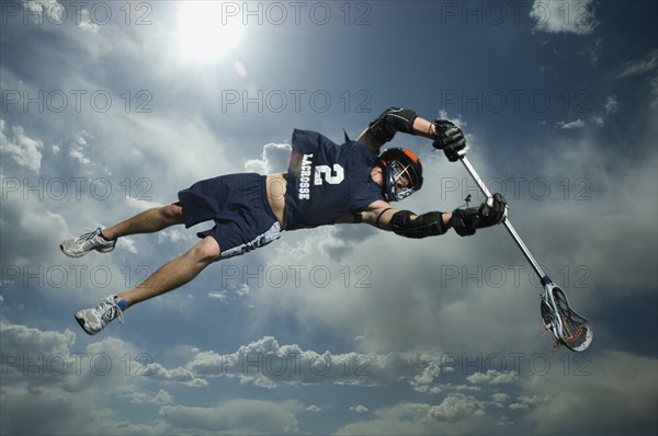 Low angle view of jai-alai player jumping. Date : 2007