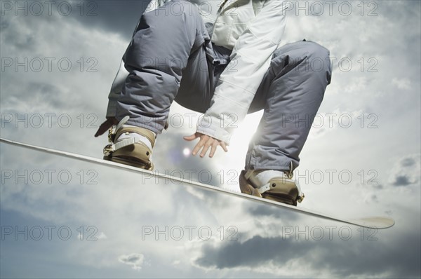 Low angle view of snowboarder. Date : 2007