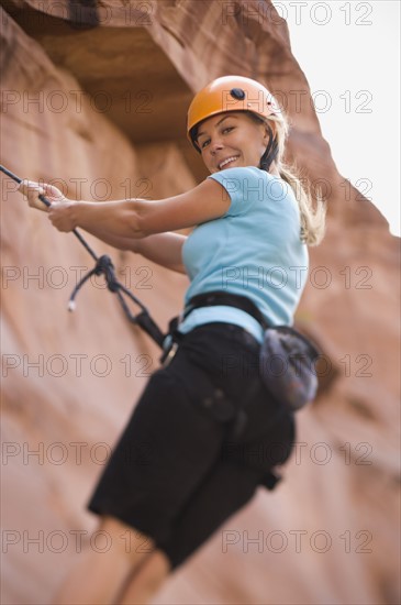 Close up of woman rock climbing. Date : 2007
