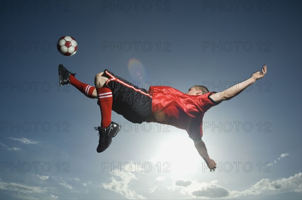 Low angle view of soccer player jumping. Date : 2007