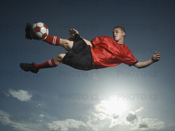 Low angle view of soccer player jumping. Date : 2007