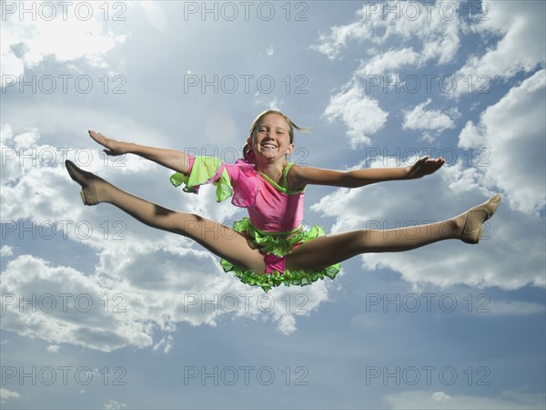 Low angle view of girl jumping. Date : 2007