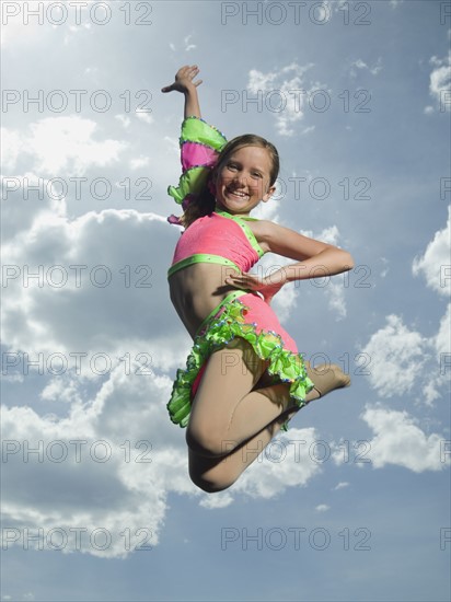 Low angle view of girl jumping. Date : 2007