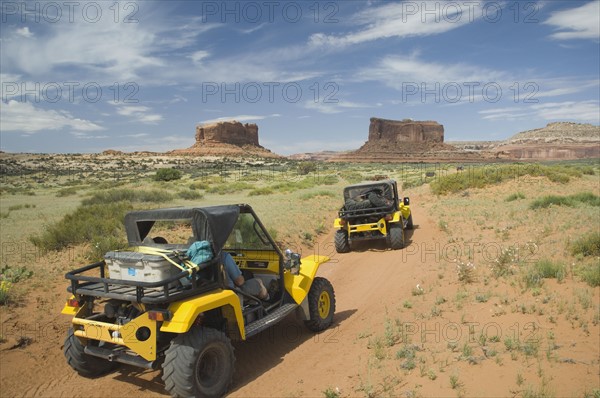 Off-road vehicles driving through desert. Date : 2007