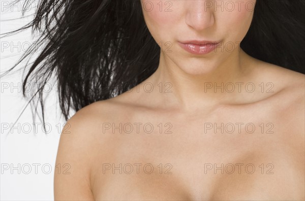 Close up of bare shouldered woman.