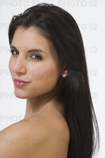 Bare shouldered woman with long hair.