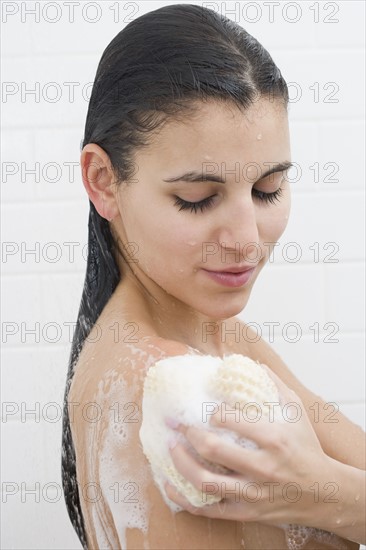 Woman washing in shower.