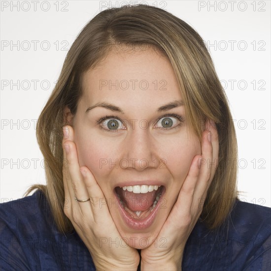 Close up of woman looking surprised.