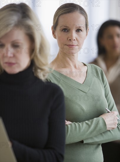 Businesswoman with arms crossed.