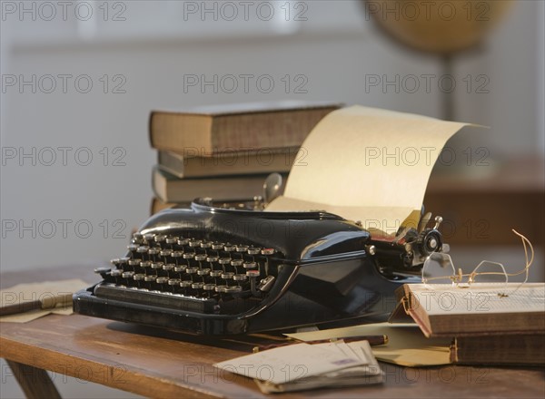 Antique typewriter on table.