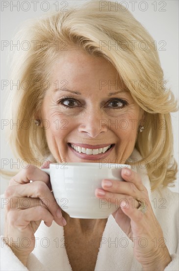 Senior woman drinking coffee.