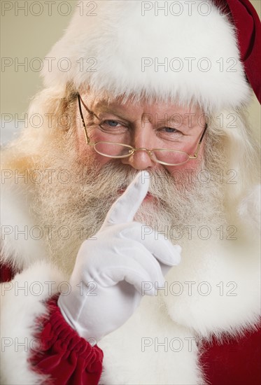 Santa Claus shushing.