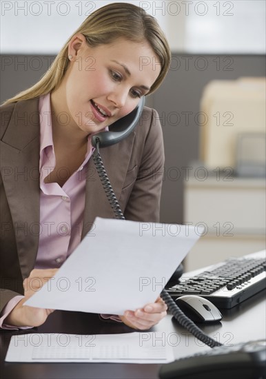 Businesswoman talking on telephone.