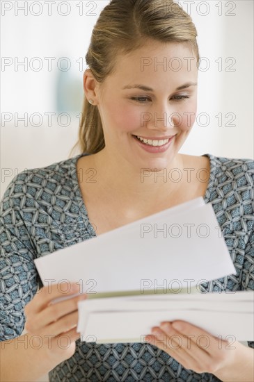 Woman looking at mail.