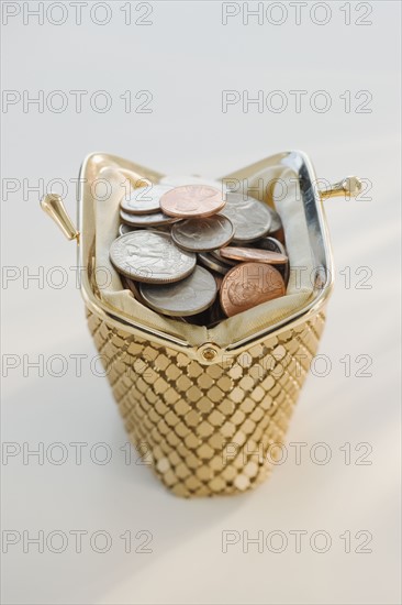 Coins in open change purse.