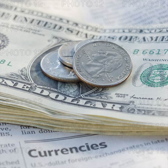 Close up of coins and paper money.