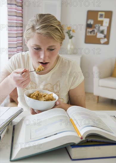 Teenaged girl doing homework.