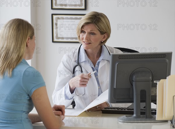 Female doctor talking to patient.