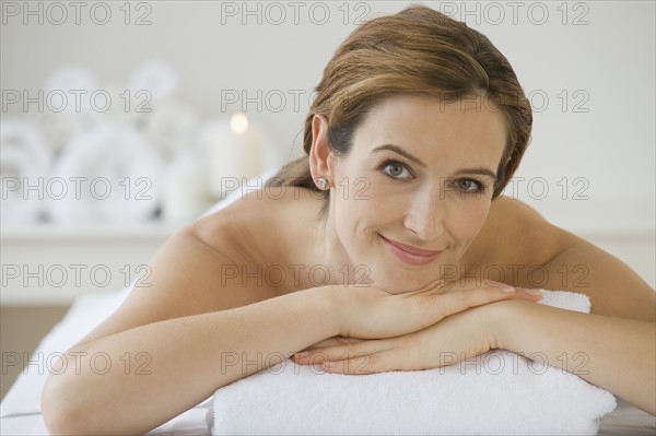 Woman laying on spa table.