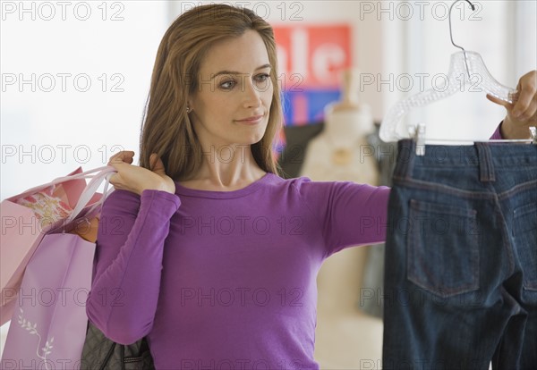 Woman shopping for clothing.