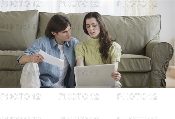 Couple looking at laptop.