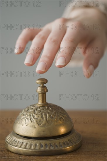 Woman ringing service bell.