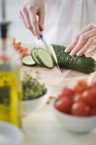 Woman chopping vegetables.