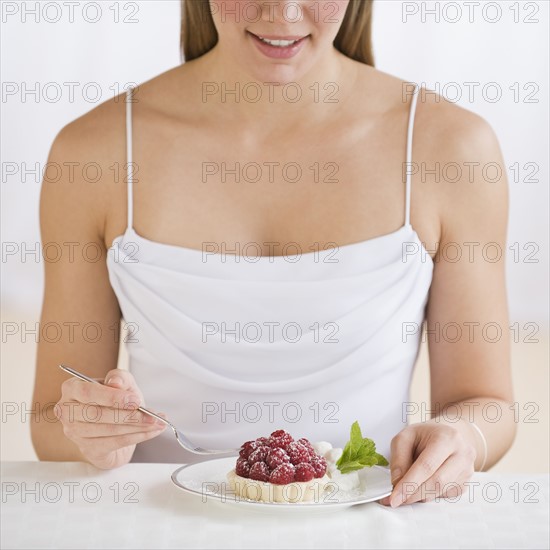 Woman eating desert.