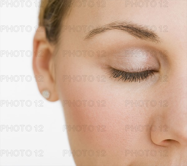 Extreme close up of woman’s closed eye.